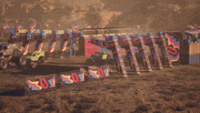monster trucks are racing on a dirt track with a sign that says 301 on it