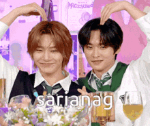 two men are making a heart shape with their hands and the word saria nag is on the bottom of the picture