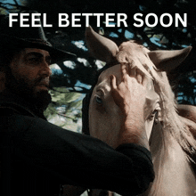 a man petting a horse with the words " feel better soon " below him