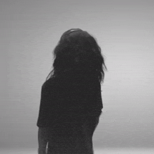 a black and white photo of a woman 's head