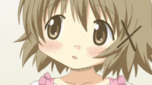 a close up of a girl 's face with a pink bow