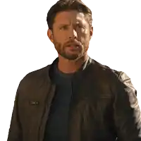 a man with a beard and a leather jacket looks surprised