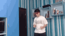 a boy wearing sunglasses and a shirt that says ' i love you ' on it is dancing
