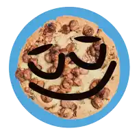 a cookie with a face drawn on it on a blue background