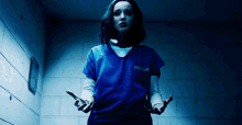 a woman in a blue uniform with the word prison on the front