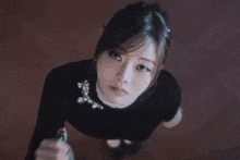 a woman taking a picture of herself in the dark