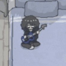 a person is sitting on a bed playing a guitar .