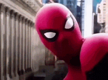a close up of a spider-man costume on a city street .
