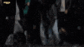 a group of people are standing in front of a ten ten sign