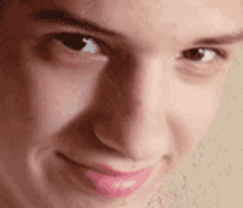 a close up of a person 's face with a smile on it