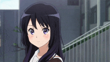 a girl with long black hair and purple eyes stands in front of a fence