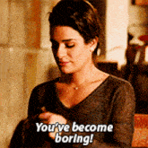 a woman says you 've become boring while looking at her phone