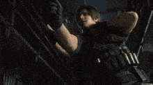 a man is holding a gun in a video game while standing next to a woman in a dark room .