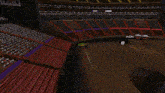 a monster truck is driving down a dirt track in a stadium
