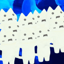 a row of white cats with a blue background