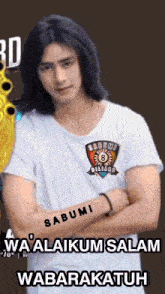 a man with a tattoo on his arm is wearing a sabumi shirt