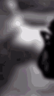 a blurry black and white photo of a person