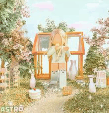 a girl is standing in front of a greenhouse surrounded by trees and flowers .