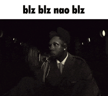 a black and white photo of a man with blz blz nao blz written on the top