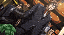 a man in a suit and tie stands in front of a group of men