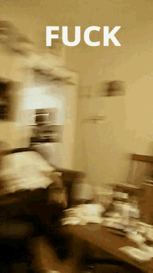 a blurry picture of a room with the word fuck in white