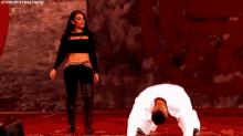 a man and a woman are dancing together in a room .