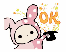 a pink bunny is holding a top hat with the word ok written on it
