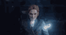 a pixelated image of a woman in a suit with the letter i on her jacket