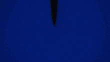 the letter y is glowing in the dark with a blue background