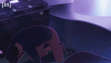 a person is kneeling down in front of a dj controller that says [ as ] on the bottom