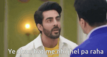 a man with a beard is talking to another man with the words ye jhanjhat me nhi jhel pa raha
