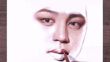 a person is drawing a portrait of a man 's face with a pencil .