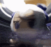 a blurred image of a person 's face with horns