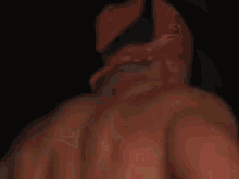 a shirtless man wearing a red bandana on his head is smiling .