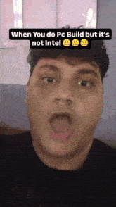 a man is making a funny face with a caption that says when you do pc build but it 's not intel