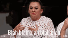 a woman in a white lace top says blah blah blah