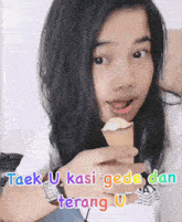 a girl is holding an ice cream cone with the words taek u kasi gede dan terang u written below her