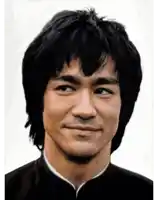 a close up of a man 's face with black hair