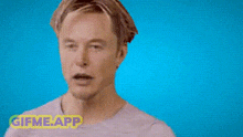 the back of a man 's head is shown with a blue background and a gif me app sticker .