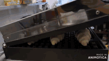 croissants are being made in a machine that is made in animotica