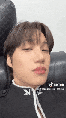 a close up of a person 's face with a tiktok sticker on it