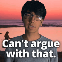 a man wearing glasses says " can 't argue with that " in front of a beach
