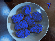 a plate of blue chicken nuggets with the number 7 in the corner