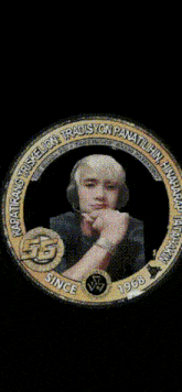 a picture of a man with headphones in a circle that says tradisyon on it