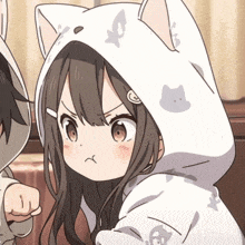 a girl wearing a cat hoodie is standing next to a boy wearing a dog hoodie .
