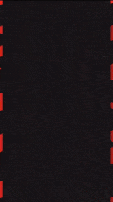 a man wearing a red and black striped shirt with the name alernando on it