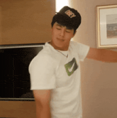 a young man wearing a hat that says obey