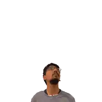 a man with a beard and glasses is looking up at the number 16