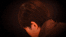 a close up of a person 's face with a blurred background