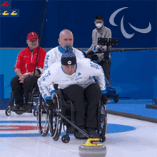 Pushing The Curling Stone Wheelchair Curling GIF - Pushing The Curling Stone Wheelchair Curling Lauri Murasov GIFs